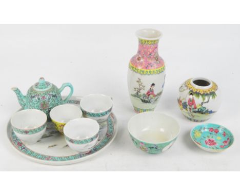 A group of 20th century Chinese enamel decorated teaware comprising circular tray with three matching cups, diameter 26cm, an