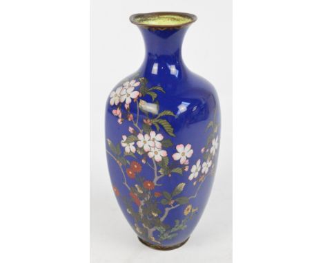 A Japanese Meiji period cloisonné enamel vase of square ovoid form with flared rim, decorated with blossoming prunus branches