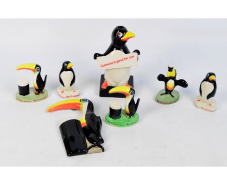 Five small Carlton Ware Guinness figures, three featuring the toucan and two penguins and a Carlton Ware Guinness penguin lam