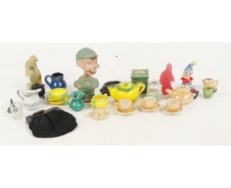 A collection of miniature ceramics, also a pink carved Chinese figure, a soapstone figure, a Wade Noddy, etc.