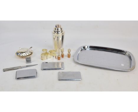 A French electroplated Art Deco style cocktail shaker with built-in lemon squeezer, St. Medard, height 20cm, boxed, a cased s