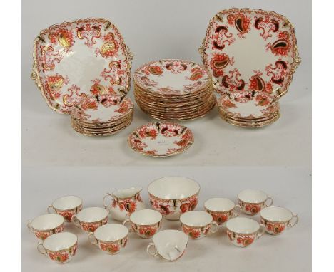 An early Royal Crown Derby floral decorated tea service comprising twelve cups, twelve saucers, twelve side plates, two sandw