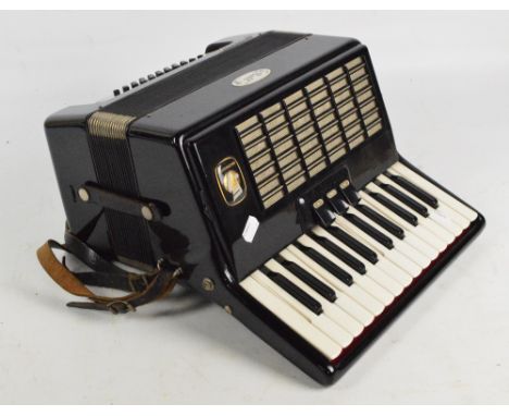 A Weltmeister "Stella" piano accordion, cased with various booklets.