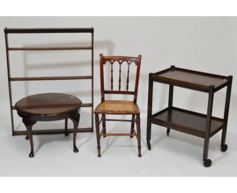 An oak two tier trolley, top 40 x 61cm, a mahogany circular occasional table on four cabriole legs, height 43cm, an oak wall 