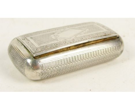 A white metal snuff box of rounded rectangular form with overall engine turned decoration centred with a vacant shaped cartou