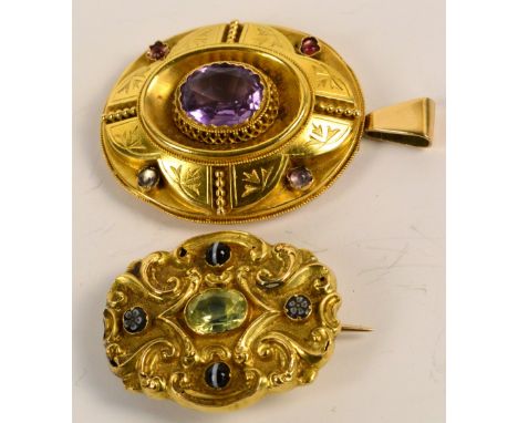 An early 20th century yellow metal scroll decorated mourning brooch set with oval peridot and four smaller gem stones, engrav
