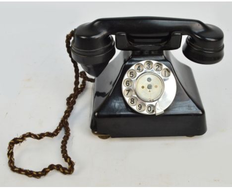 A vintage GEC black telephone.