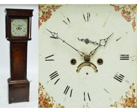 An early 19th century oak and mahogany crossbanded eight day longcase clock with square painted dial, arched door, flanked by