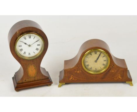An Edwardian mahogany balloon shaped mantel timepiece with satinwood inlaid detail and white enamel dial set with Roman numer