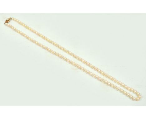 A cultured pearl necklace with 9ct gold clasp set with single pearl, length 60cm, diameter of each pearl 5mm.