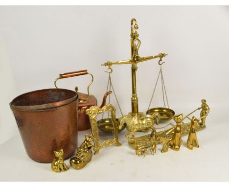 A set of brass beam scales with weights set to the frame, a copper kettle, a brass model of a ploughing horse, etc.