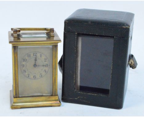 A c.1900 French brass cased carriage clock with paper dial set with Arabic numerals, the movement stamped R&Co and in origina