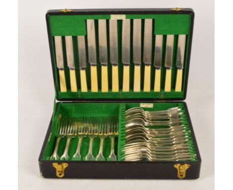 A canteen of Victorian hallmarked silver flatware in fiddle and thread pattern with crested finials comprising six dinner for