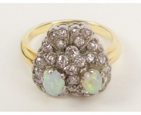 A yellow metal opal and diamond Art Deco ring in the form of an owl's face, size J. CONDITION REPORT: 5.2g. Probably 1930s. T