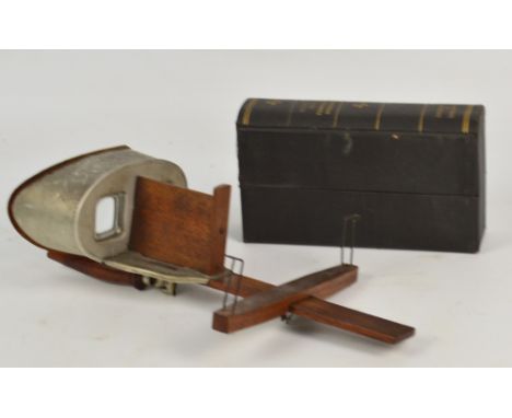 A hand held stereoscope, with a number of cards including Hunting Series by Underwood & Underwood, and various mixed cards.