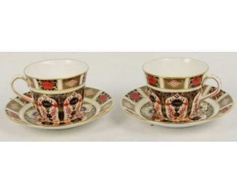 A pair of Royal Crown Derby Imari decorated 1128 pattern cups and saucers (all seconds), diameter of saucer 15cm.