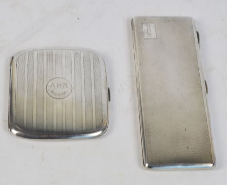 An Edward VIII hallmarked silver combination cigarette case and matchbook holder, with overall engine turned decoration and w