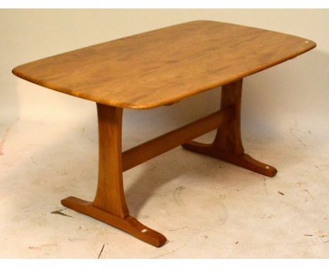 An Ercol light elm refectory table with rounded rectangular top, top 151 x 73cm. CONDITION REPORT: Very minor surface scratch