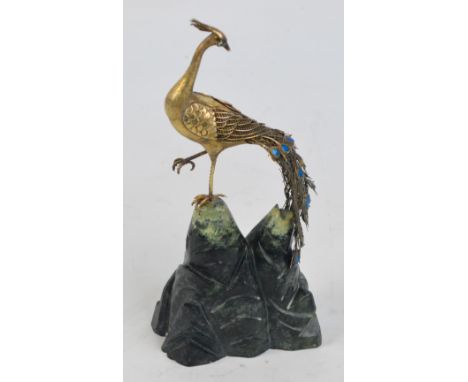 A Chinese sterling silver gilt limited edition "Peking Peacock", with enamel decorated tail and eyes, 353/560, on green hards