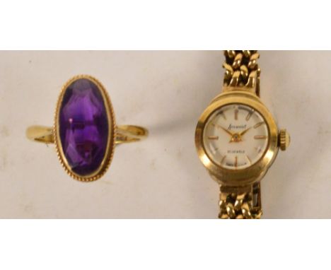 A 9ct yellow gold ring set with an oval amethyst, size Q, and a 9ct yellow gold cased ladies Accurist wristwatch, the circula