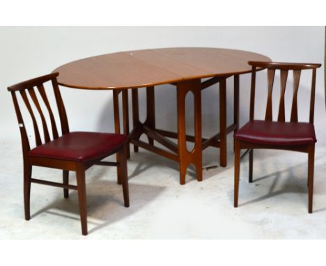 A 1970s teak dropleaf dining table with four stick back chairs with padded and square section tapering front legs (5).