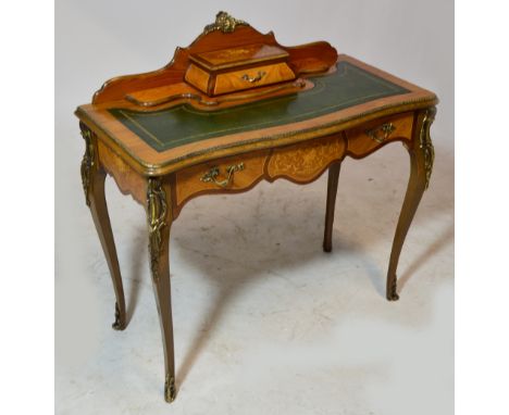 A reproduction French floral inlaid lady's writing table, the raised back with single trinket drawer, leather tooled serpenti
