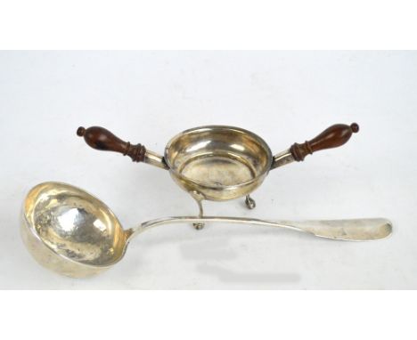 A white metal ladle with hammered bowl and flattened fiddle pattern shaped finial with monogram, length 36.5cm, and a white m