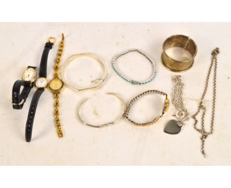 A quantity of costume jewellery including silver bangle, two silver bracelets and four fashion watched.