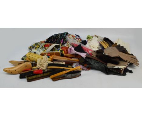 A quantity of various gloves to include elbow length examples, leather fur lined winter examples, and some early early 20th c