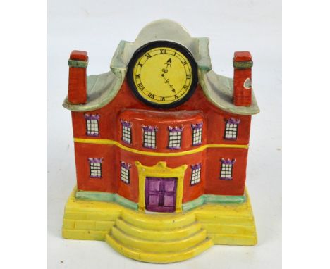 An unusual Victorian Staffordshire model of a mansion house with clock face and apertures to the back and top, width 17cm (af