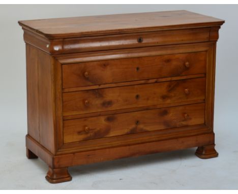 A three drawer commode with plank top and ogee bracket feet.