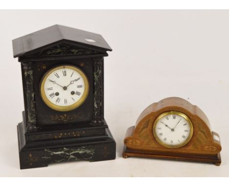 A late 19th century French black slate and green marble detailed mantel clock, the white enamel dial set with Roman numerals 