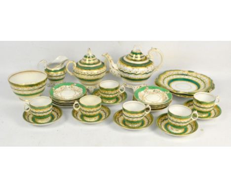 A mid 19th century English part tea service, gilt heightened on a green an cream ground. CONDITION REPORT: Some staining. Tea