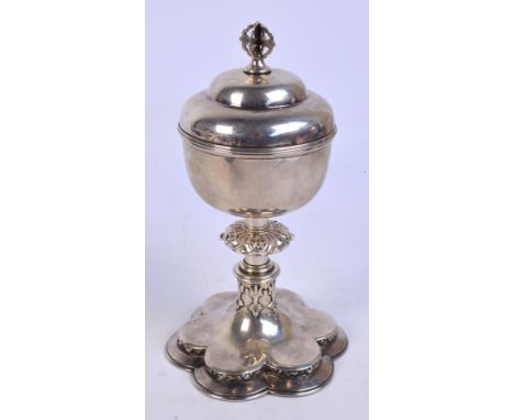 A Victorian white metal ciborium and cover, the plain bowl with gilt wash interior above cylindrical knopped stem with cut-ca