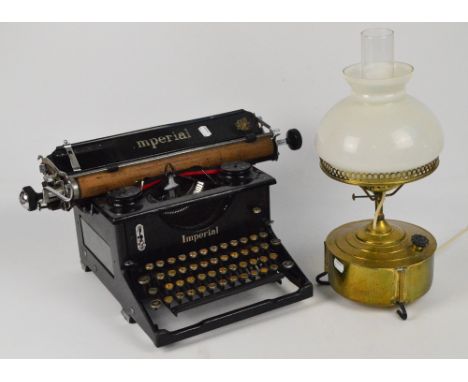 A vintage Imperial typewriter and a brass lamp converted to electricity (2).
