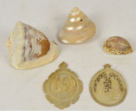 A carved cameo shell depicting a horse drawn carriage, a small carved shell inscribed "Present for my dear Henry", a further 