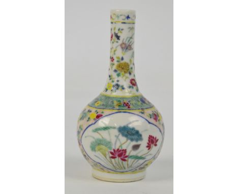 A late 19th century Chinese Famille Vert bottle vase decorative with flowers, bearing four character painted mark to base, he