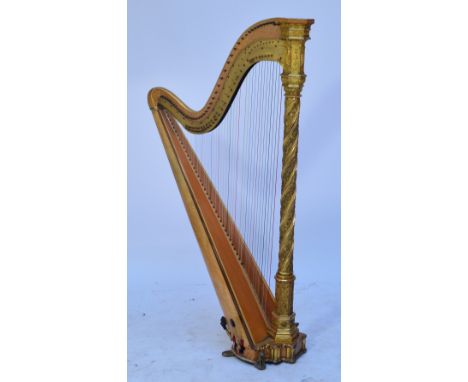 A 19th century Gothic style double action harp by Erard with wrythen column and decorated in relief with figures, numbered 46