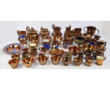 A large quantity of copper lustre ware including a three piece tea set with some cups and saucers, several jugs, a teapot, tw