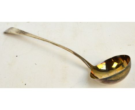 A George III hallmarked silver Old English pattern ladle with circular bowl with gilt wash interior, the terminal engraved "T