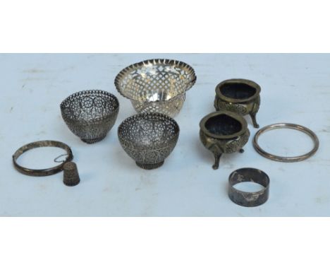 A collection of hallmarked silver items comprising a pierced bowl, Chester 1901 (af), a decorated thimble, Charles Horner, Ch