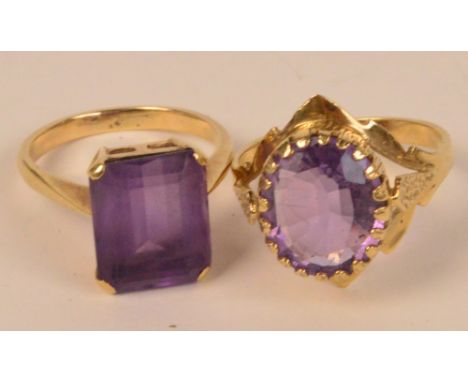 Two 9ct gold dress rings set with amethyst coloured stones. CONDITION REPORT: Appears good with no obvious signs of faults, d