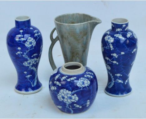 A pair of c.1900 Chinese blue and white vases decorated with cracked ice and prunus design, four character marks to base, als