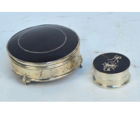 A George V hallmarked silver and tortoiseshell mounted circular trinket box with hinged lid and velvet lined interior raised 