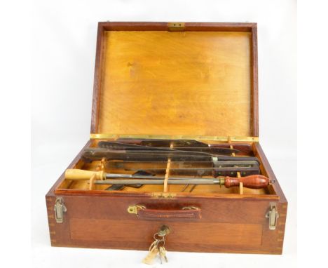 A vintage cased set of chef's knives and utensils, the hinged lid enclosing fitted interior with knife racks and with pull-ou