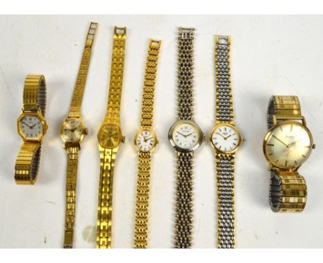 ACCURIST; a 1960s gentleman's 9ct gold cased "Shockmaster" wristwatch with twenty one jewels, the champagne dial set with bat