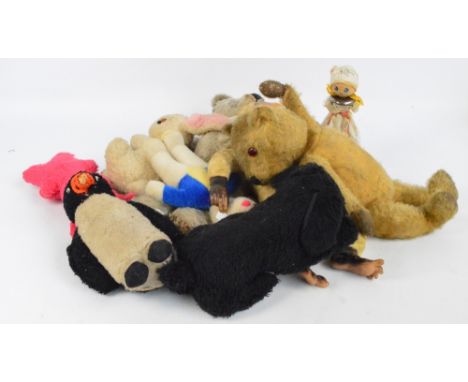 A collection of vintage soft toys and glove puppets including teddy bears, rabbits, Sooty and Rupert puppets, etc. CONDITION 