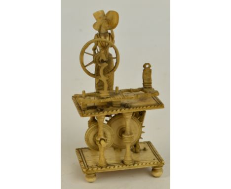 A Napoleonic era prisoner of war carved bone "Spinning Jenny" automaton, height 10cm. CONDITION REPORT: There are some losses