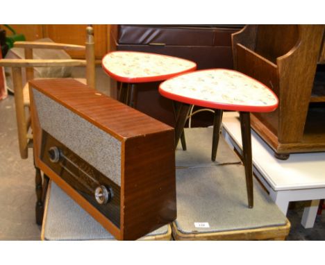 A pair of vintage tripod tables on Sputnik style supports and a radio