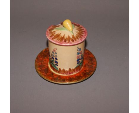 An Art Deco 'Hollyhocks' preserve pot and saucer by Carltonware CONDITION REPORT; Good condition, no sign of damage or repair